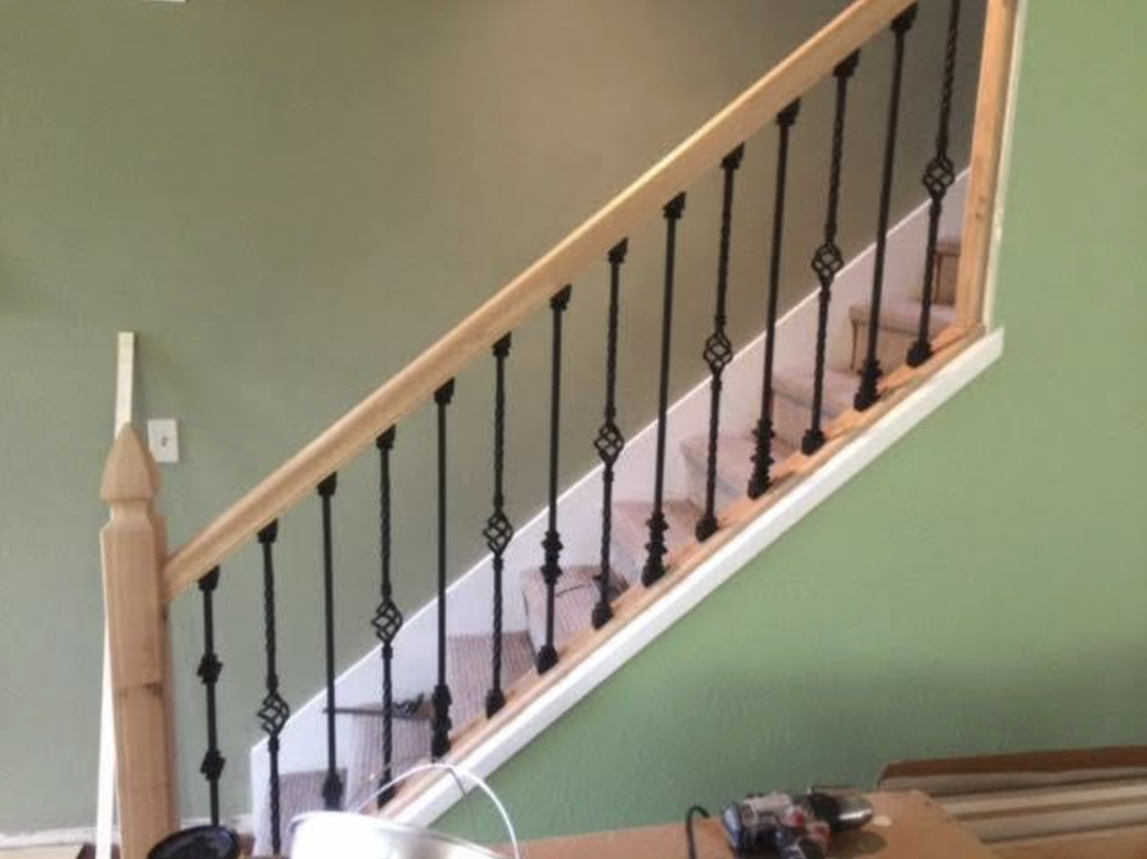Staircase railing installation in progress